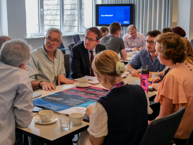 Future Councils roundtable event in London - a group of people sitting around a table and talking to each other